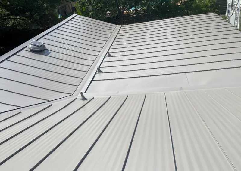 Solar attic fan installed on a metal roof for Roof Ventilation in Ewa Villages